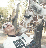 Howard Gilman with a Giraffe